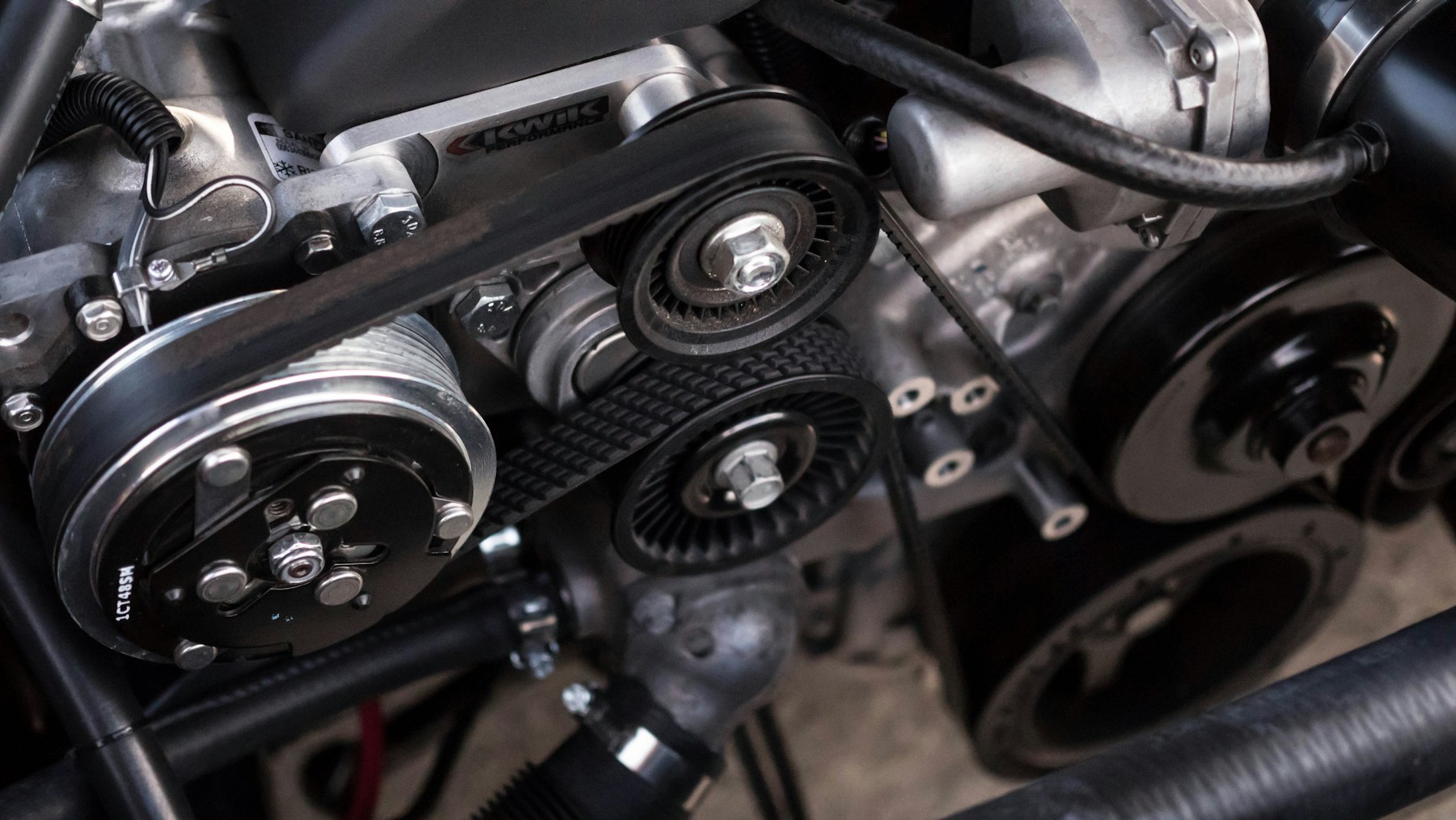 Automotive service business owner and technician working in a professional repair shop